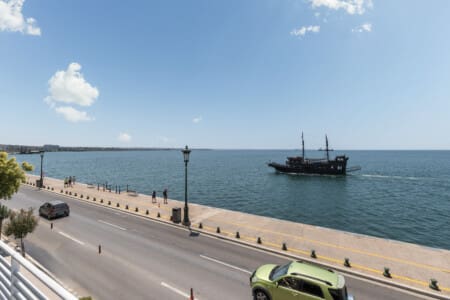 Ivory premium two-bedroom apartment on Leoforos Nikis in Thessaloniki with elegant design, sea views, and modern amenities for a luxurious stay.